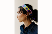 Profile shot of model wearing scarf as a headband