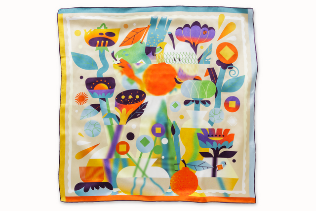 Flatlay image of 100% silk square scarf featuring a collage of fruits, vegetables, and flowers in luscious shades of yellow, with pops of orange, blue, and purple throughout.
