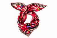Rolled image of 100% silk square scarf featuring a motif of interlocking staircases and platforms in various shades of red accented with pops of blue and green. A neutral stripe border around the scarves' edges.