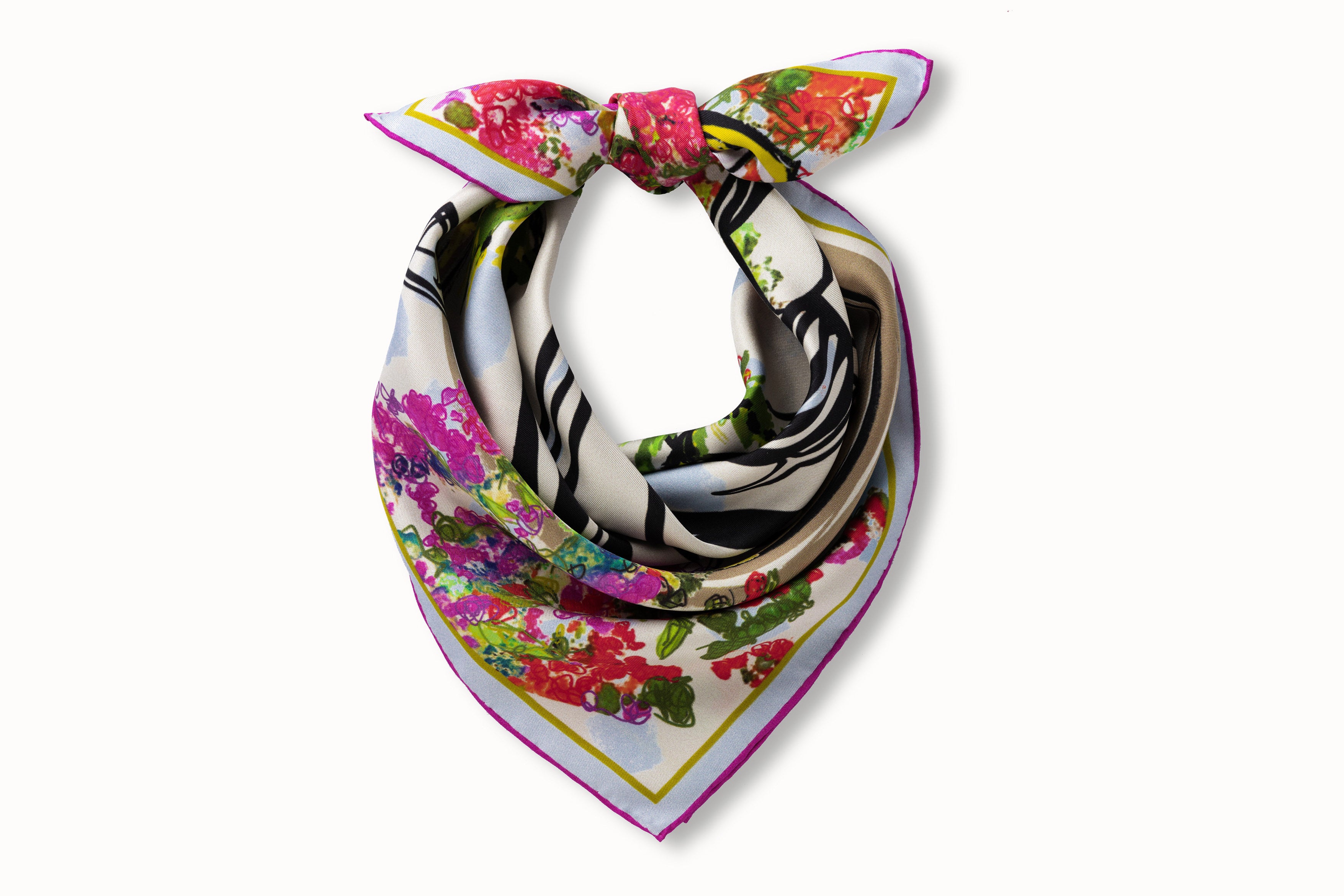 Image of a rolled and knotted 100% silk square scarf featuring a motif of three black female stick figures dressed for a night out and standing in front of the hotel entrance surrounded by urns and floral arches. The elements are in various shades of pink, green, soft red and baby blue splashed across a white background.