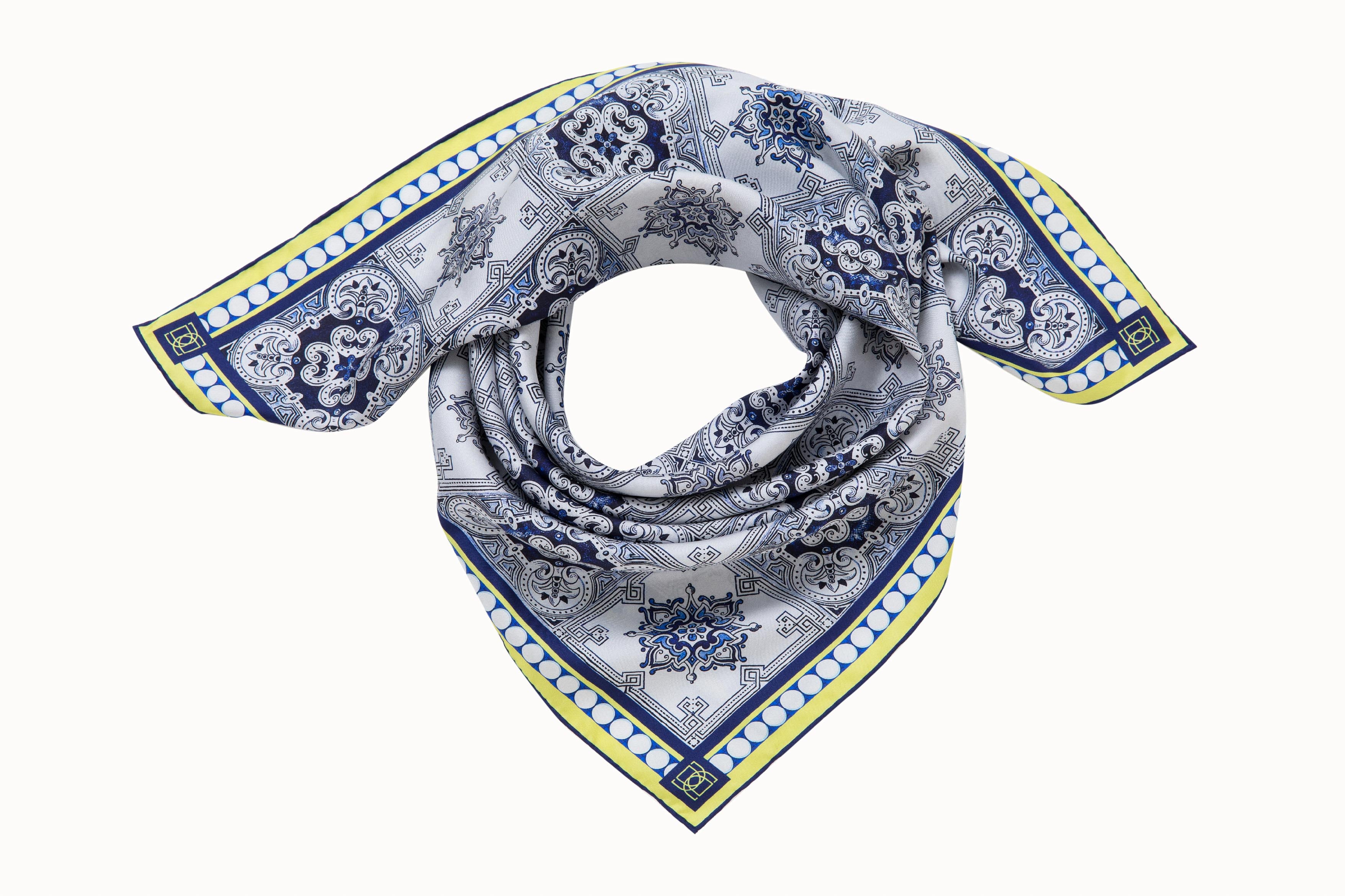 blue patterned scarf displayed for wearing around the neck