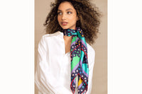Female model wearing scarf with stars and clouds
