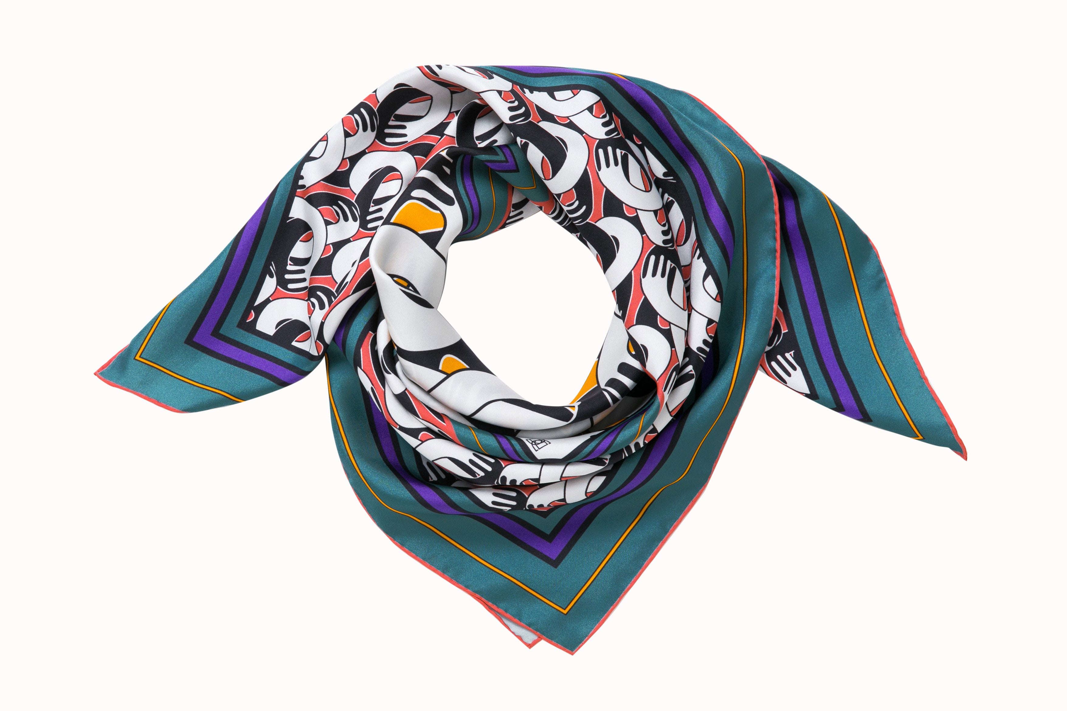 Rolled image of 100% silk square scarf featuring a motif of black and white intertwined hands. The larger scale hands motif in the center is on a pumpkin colored background and is surrounded by smaller scale hands on a pink coral colored background. The scarf has a green and purple border.