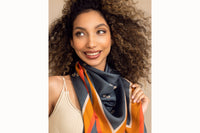 woman wearing scarf while smiling and looking up